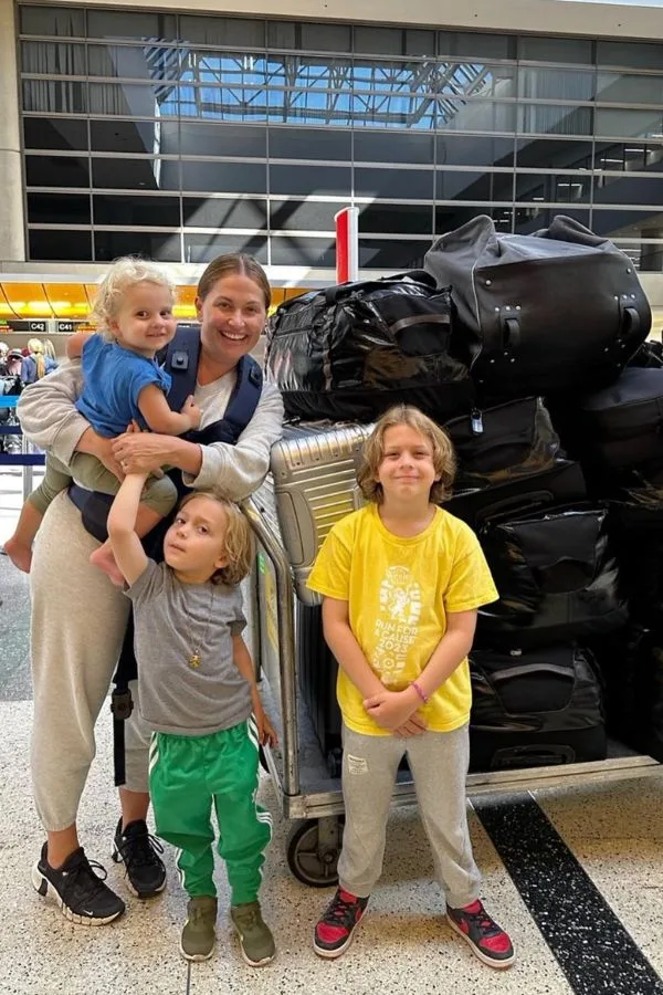 Happy family at LAX airport with their luggage - Barrett and the Boys