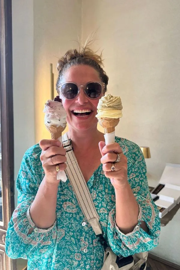 happy woman holding two cones of gelato in Turin, Italy - Barrett and the Boys