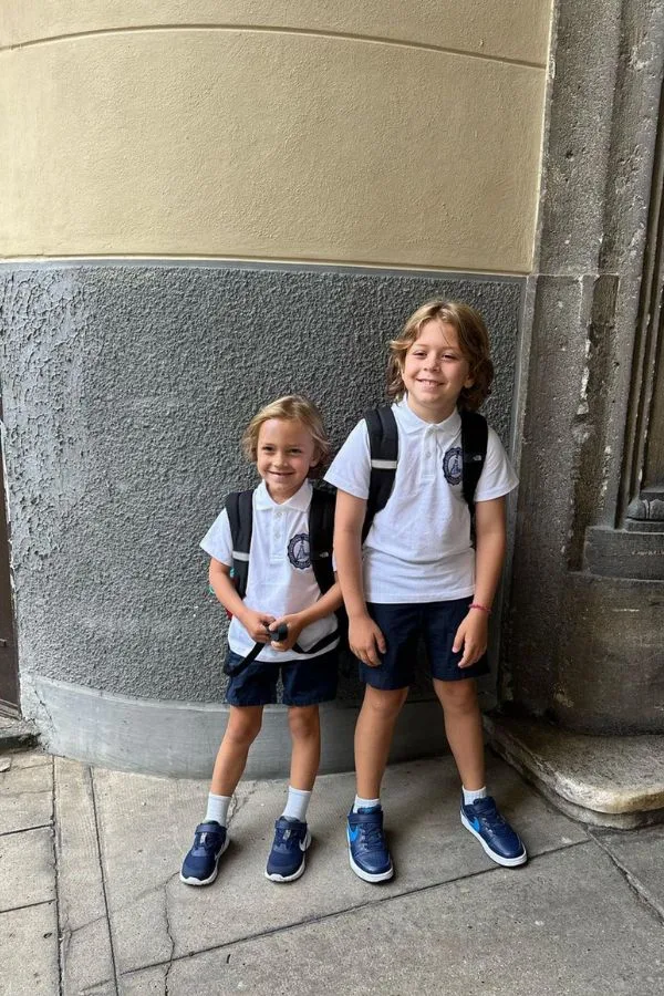 two blonde boys dressed in school uniforms Turin, Italy- Barrett and the Boys