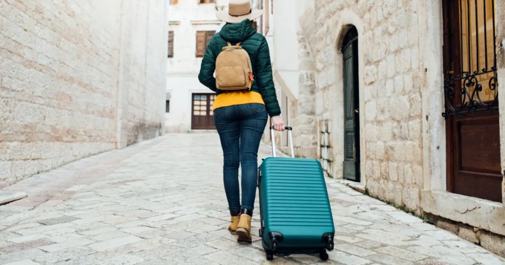 Woman with luggage in Italy