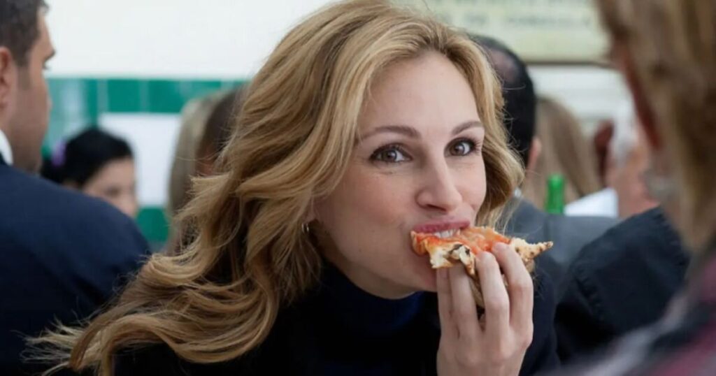 Julia Robers in Eat Pray Love eating pizza in Italy