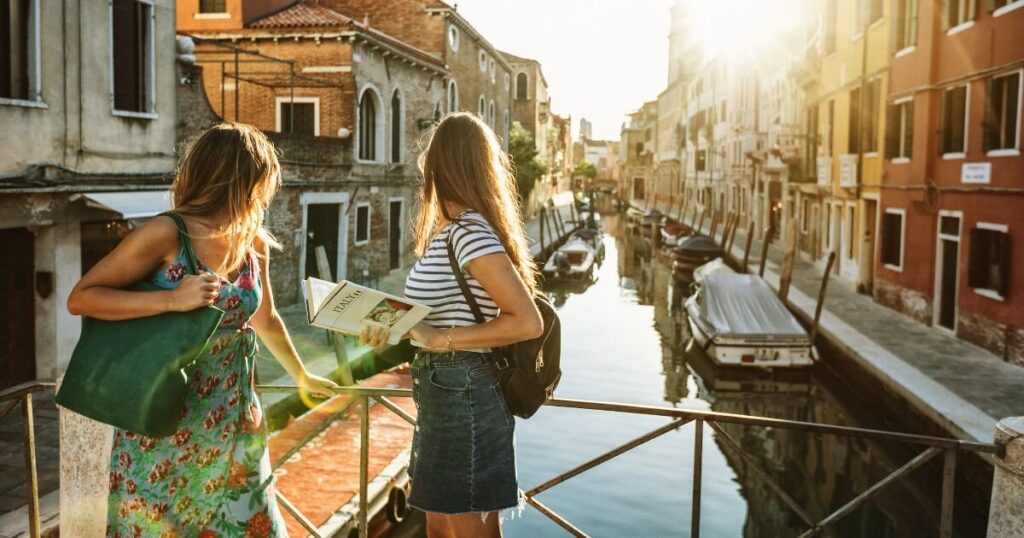 Tourists on a canal in Venice